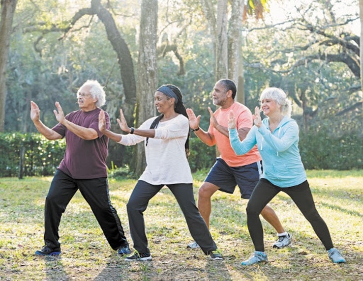 Older group exercising outside