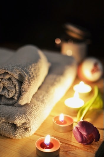 Saunas use, candles next to towels