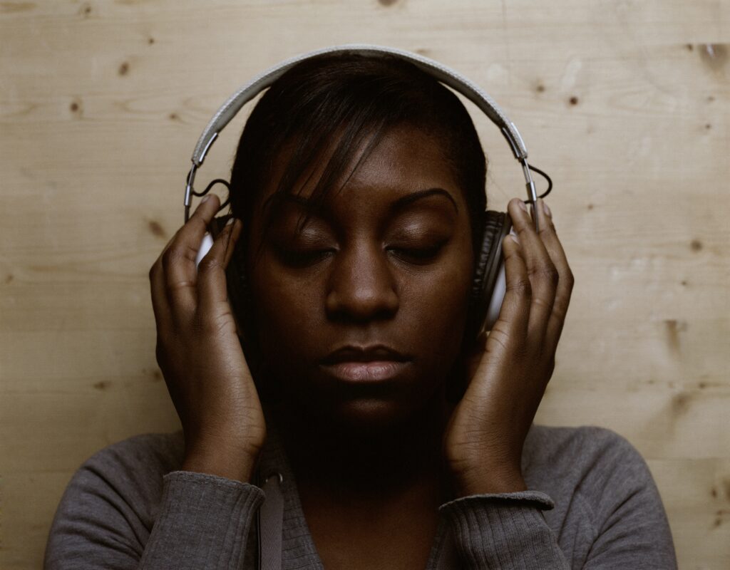 woman peacefully listening to music with headphones