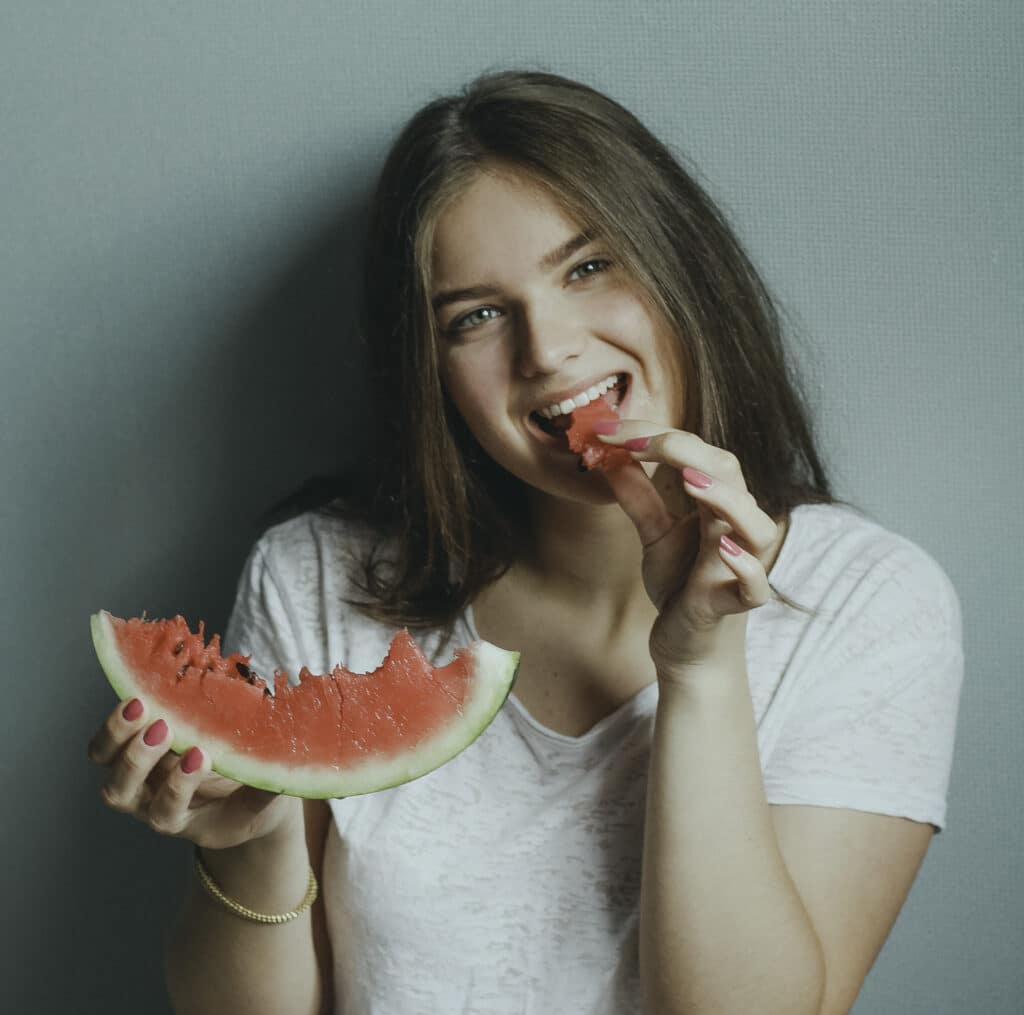 Vegetarian Girl Eating A Slice of Watermelon.
